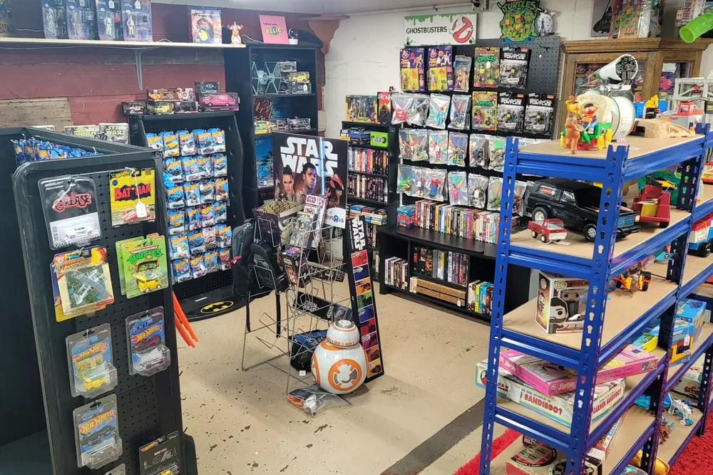 The shop floor at 605 Diecast with pegboards of toys, shelving and a Star Wars display